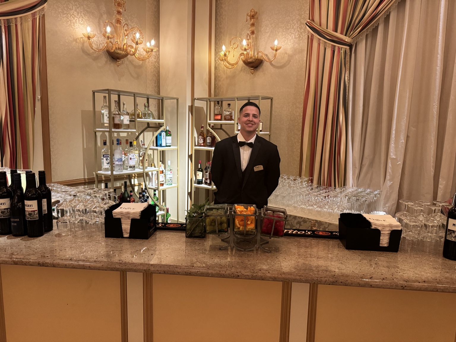 Professional bartender at a prepared bar